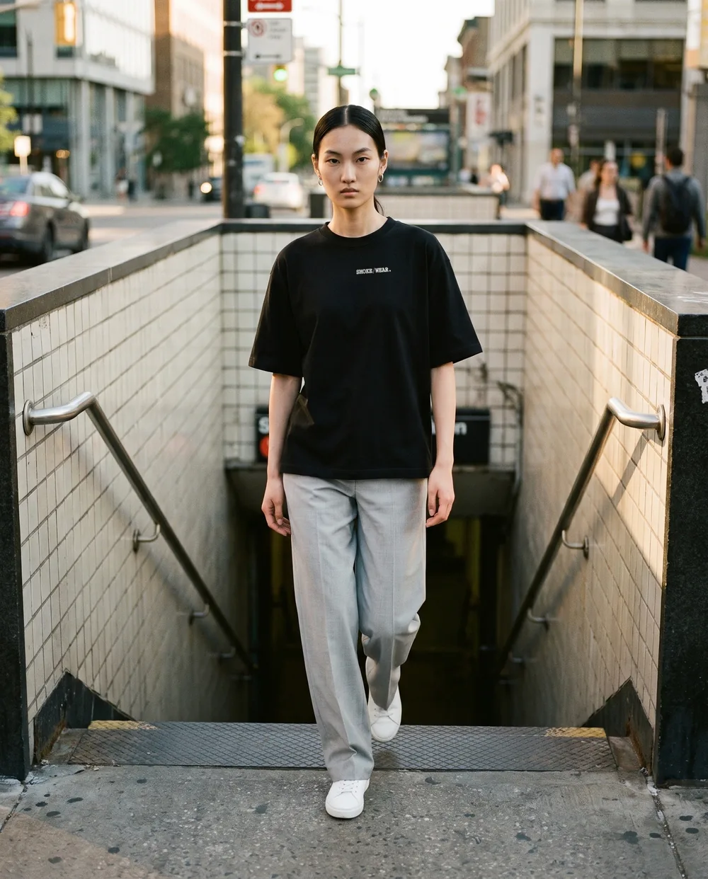 Coming up the steps of a subway entrance